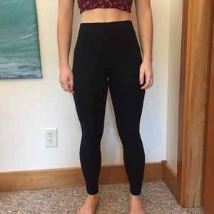 Women’s black leggings.